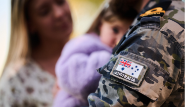 A man in ADF uniform with a family